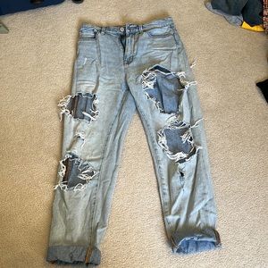 Very distressed boyfriend fit blue jeans